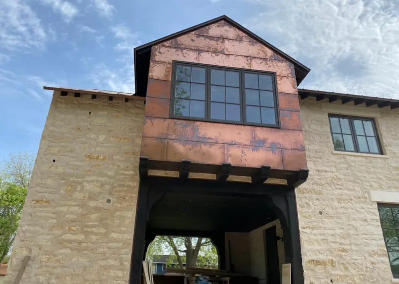 Copper metal panel facade on a stone building for Roof Repair in West Sacramento