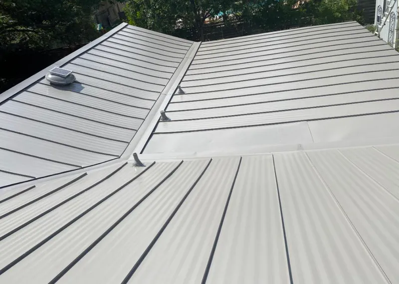 Solar attic fan installed on a metal roof for Roof Ventilation in West Sacramento